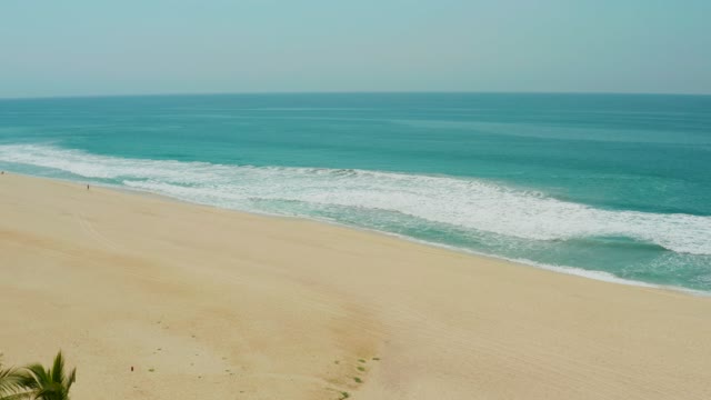 CAMPESTRE SAN JOSE DEL CABO BCS MEXICO-2021: Sandy Beach and Ocean Waves with Receding Palm Trees