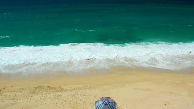 LA LAGUNA BEACH LOS CABOS MEXICO-2021: Beachgoers Leaving As Waves Roll In