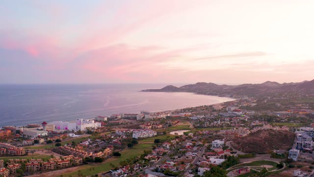 SAN JOSE DEL CABO MEXICO-2021: Coastal City at Sunset with Ocean and Mountains