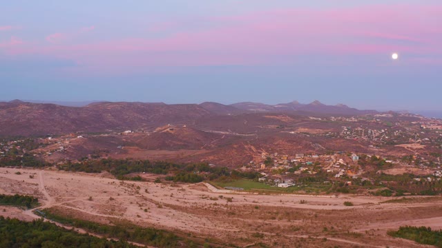 SAN JOSE DEL CABO MEXICO-2021: Desert Valley at Twilight with Moon and Distant Mountains