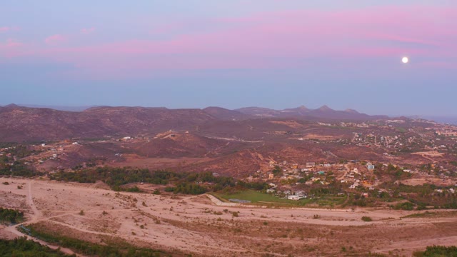 SAN JOSE DEL CABO MEXICO-2021: Vehicles Moving on Hilly Terrain at Twilight