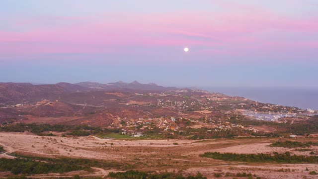 SAN JOSE DEL CABO MEXICO-2021: Mountainous Landscape with Town and Ocean at Dusk
