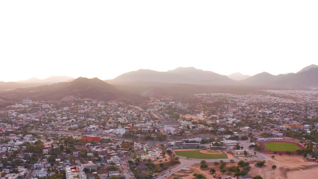 SAN JOSE DEL CABO MEXICO-2021: Cityscape with Distant Mountains at Dusk