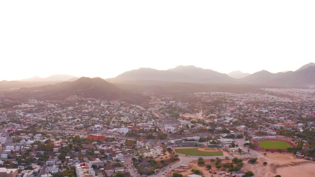 SAN JOSE DEL CABO MEXICO-2021: Suburban Neighborhood with Baseball Field and Mountain Backdrop