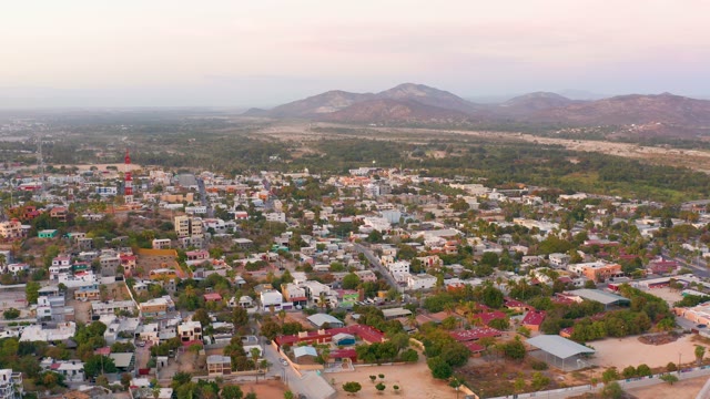 SAN JOSE DEL CABO MEXICO-2021: Aerial Pan Over Town with Mountain Backdrop