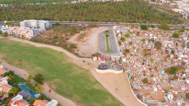SAN JOSE DEL CABO MEXICO-2021: Cemetery, Green Field, and Waterway Aerial Pan