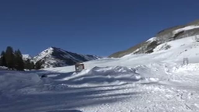 CRESTED BUTTE COLORADO-2015: Snowy Trail In The Mountains With Pine Trees And A Couple