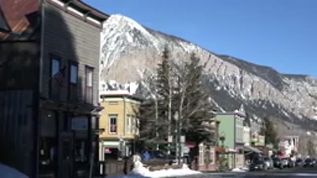 CRESTED BUTTE COLORADO-2015: Car Driving Through A Mountain Neighborhood