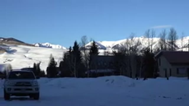 CRESTED BUTTE COLORADO-2015: Pickup Truck In Snow In Front Of Mountains