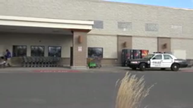 WESTMINSTER COLORADO-2015: Police Car In Front Of A Shop With Some Trolleys And