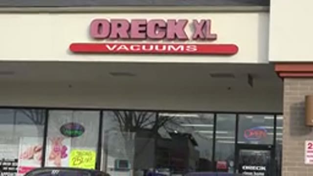 WESTMINSTER COLORADO-2015: Street Photo Of Wreck XL Vacuums And Person Taking Picture