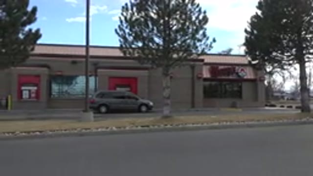 WESTMINSTER COLORADO-2015: Gray Van At Wendy's Drive Thru On A Clear Day