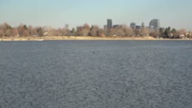 WESTMINSTER COLORADO-2015: City Buildings And Blue Lake Water On A Clear Day