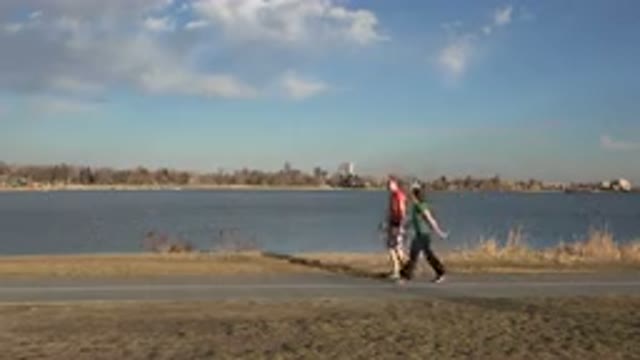 WESTMINSTER COLORADO-2015: Sports Walking On The Lakeside Near The City In The