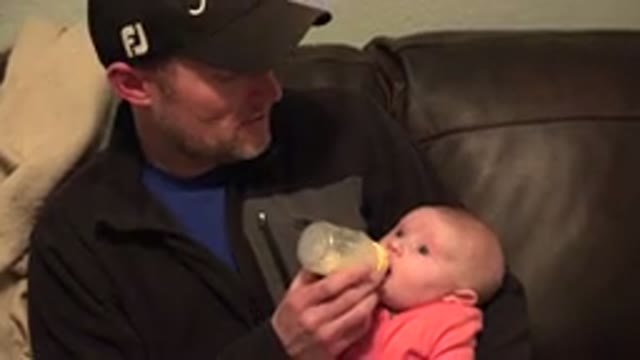 WESTMINSTER COLORADO-2015: A Father Feeding A Bottle To His Baby