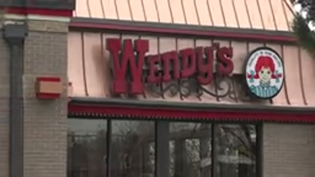 WESTMINSTER COLORADO-2015: A Panning Shot Of A Wendy's Restaurant Drive Thru
