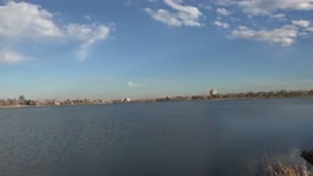 WESTMINSTER COLORADO-2015: Calm Blue Lake Water Blue Sky And White Clouds On A