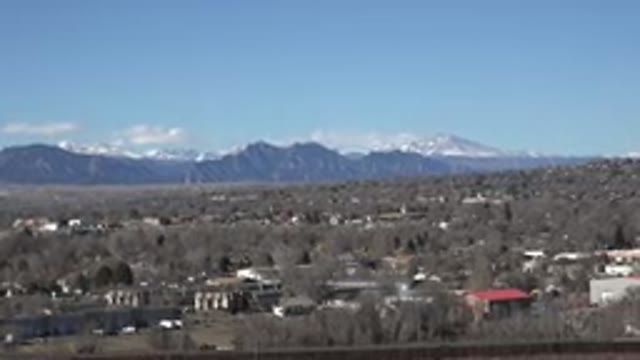 WESTMINSTER COLORADO-2015: Camera Pans From Right To Left Showing Mountains In