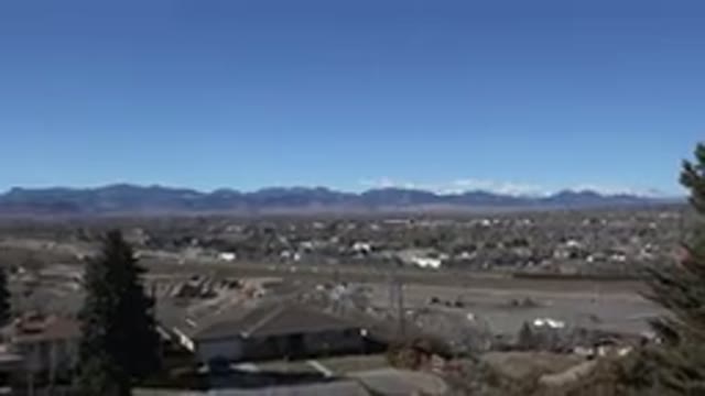 WESTMINSTER COLORADO-2015: Serene Cityscape With Green Vegetation And Modern Buildings