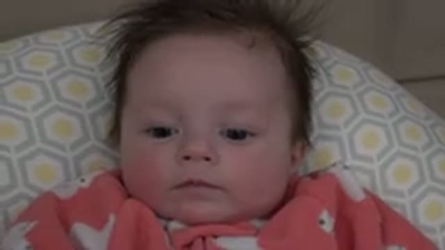 WESTMINSTER COLORADO-2015: Baby Looks At Cameraman And Makes Funny Face Moving