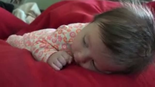 WESTMINSTER COLORADO-2015: An Infant Lies On Her Stomach Suckles Her Thumb And Kicks Her Feet
