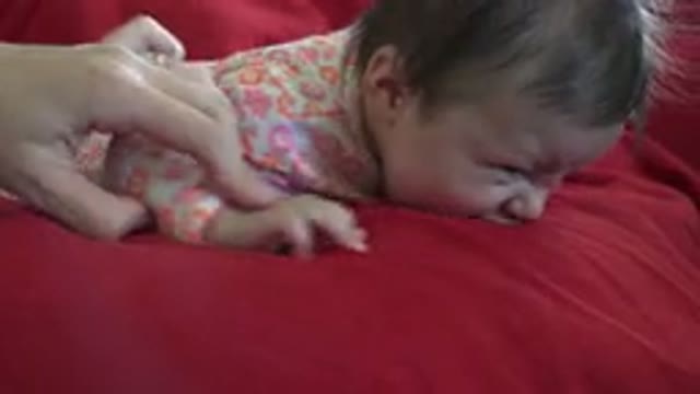 WESTMINSTER COLORADO-2015: Toddler in Flowery Pajamas Crying While Holding a Drink