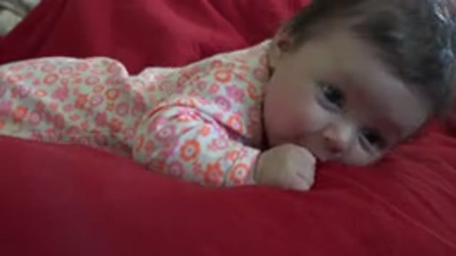 WESTMINSTER COLORADO-2015: Beautiful Baby Girl Dressed In Pink Clothes In A Crib