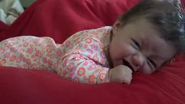 WESTMINSTER COLORADO-2015: An Infant Lying On A Red Blanket Crying