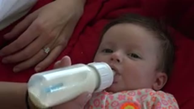 WESTMINSTER COLORADO-2015: Healthy Baby Drinking Milk From Infant Bottle