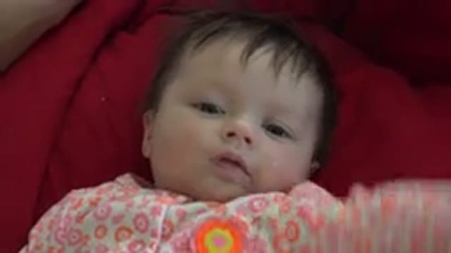 WESTMINSTER COLORADO-2015: Baby Lying on Red Blanket Being Fed with Bottle