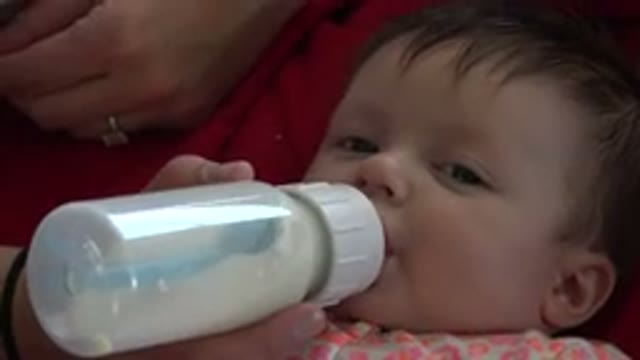 WESTMINSTER COLORADO-2015: A Baby and His Bottle Full of Milk With a Sleepy Face