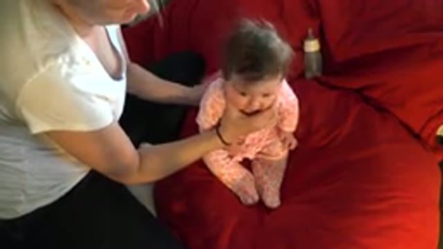 WESTMINSTER COLORADO-2015: A Mom Trying To Make Her Baby Burp By Slightly