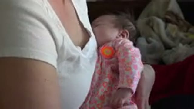 WESTMINSTER COLORADO-2015: Presumably Hungry Unhappy Infant Being Held In Woman's Arms