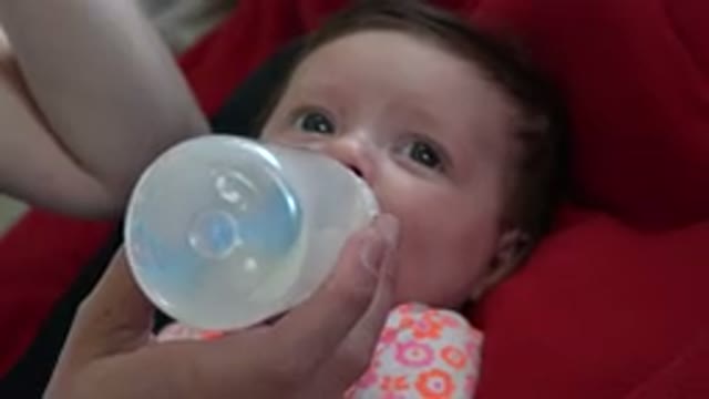 WESTMINSTER COLORADO-2015: The Baby Is Being Fed By A Milk Bottle While Lying On