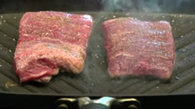WESTMINSTER COLORADO-2015: Seasoned Skirt Steak Cooking On Black Nonstick Grill