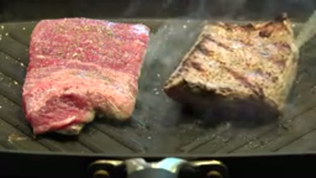 WESTMINSTER COLORADO-2015: Point of Knife Blade Stabs Piece of Red Meat on Grill