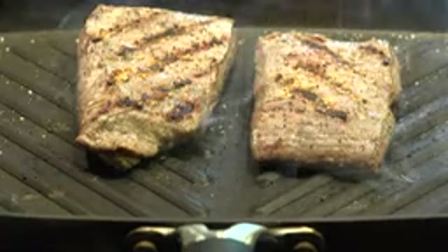 WESTMINSTER COLORADO-2015: Two Pieces Of Meat Being Grilled In The Pan