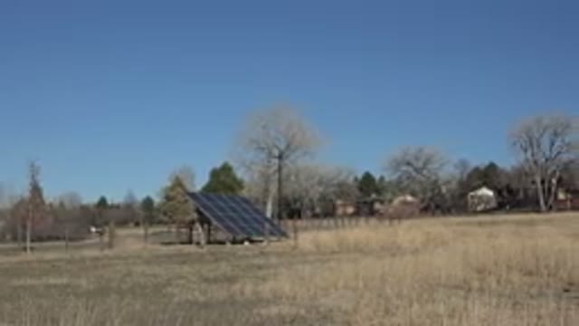 ARVADA COLORADO-2015: Sightseeing the Solar Panel in the Grassy Field