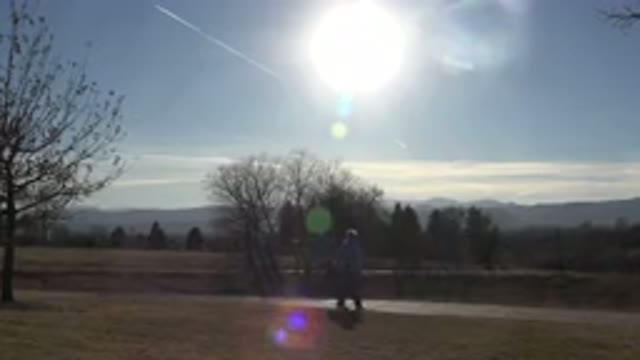 ARVADA COLORADO-2015: Old Man Walking at Evening Through a Ground