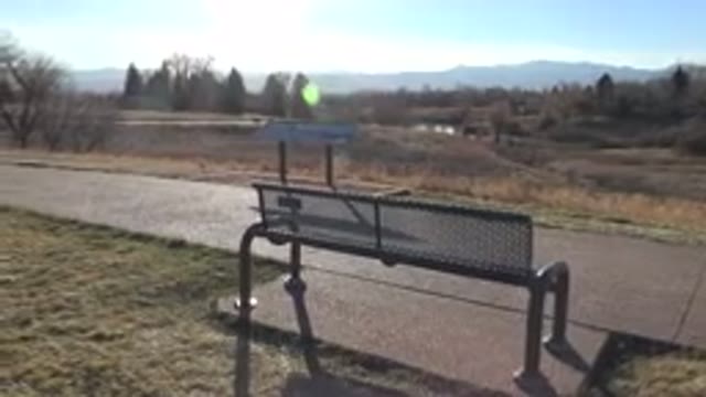 ARVADA COLORADO-2015: A Bench In Garden With Beautiful Mountains And Sky