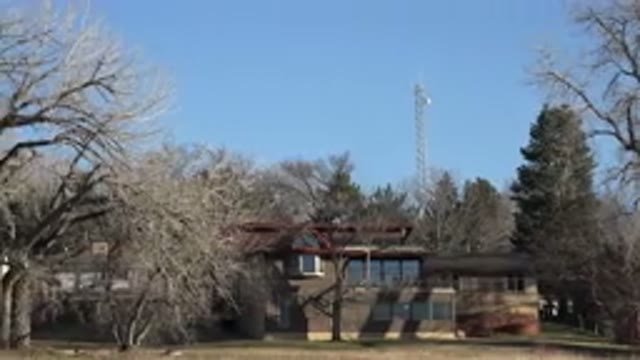 ARVADA COLORADO-2015: A Beautiful Building With Trees and Flowers