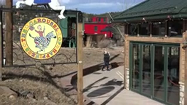 NEDERLAND COLORADO-2015: Woman Walks Road With Child