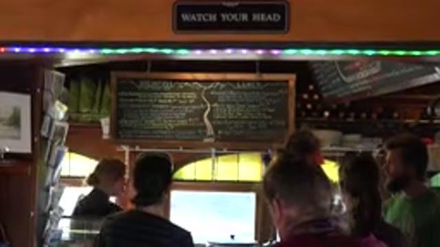 NEDERLAND COLORADO-2015: Restaurant With People Ordering At A Placard Menu And A