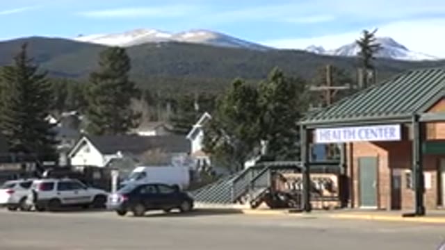 NEDERLAND COLORADO-2015: A Beautiful Building And Cars Parked In Front And