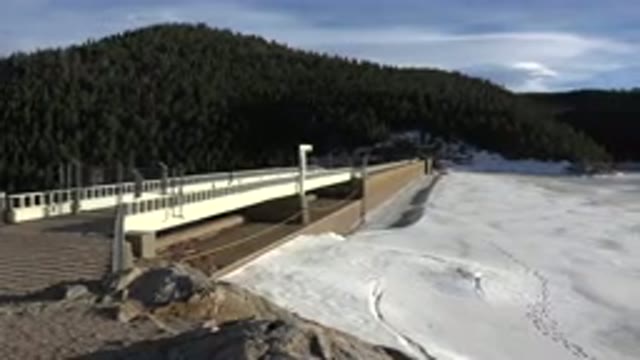 NEDERLAND COLORADO-2015: Bridge Over Snow And Mountains In The Background