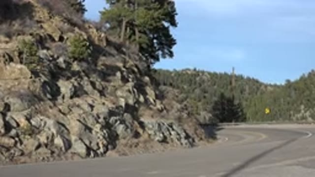 NEDERLAND COLORADO-2015: Image Of The Side Of A Mountain With A Road That Has A
