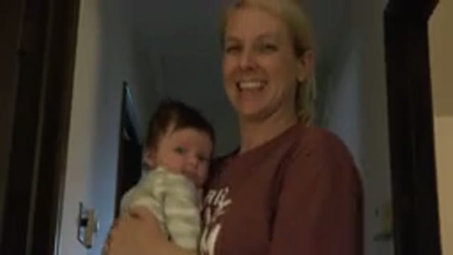 WESTMINSTER COLORADO-2015: Blonde Woman Smiling With Baby On Lap Cradling