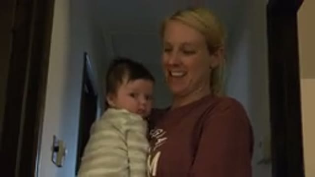 WESTMINSTER COLORADO-2015: A Blonde Woman Holds A Baby With Dark Hair While