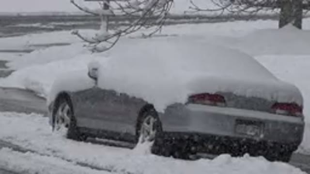WESTMINSTER COLORADO-2015: Silver Snow Covered Sedan Stuck On A Street