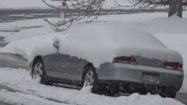 WESTMINSTER COLORADO-2015: A Gray Expensive Car Covered in Heavy Snow